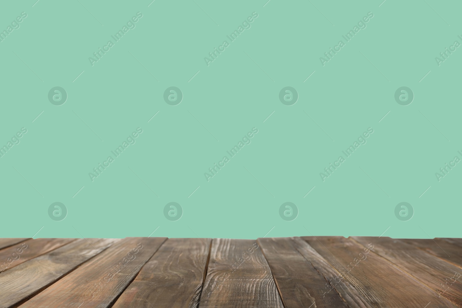 Image of Empty wooden surface on mint background. Mockup for design