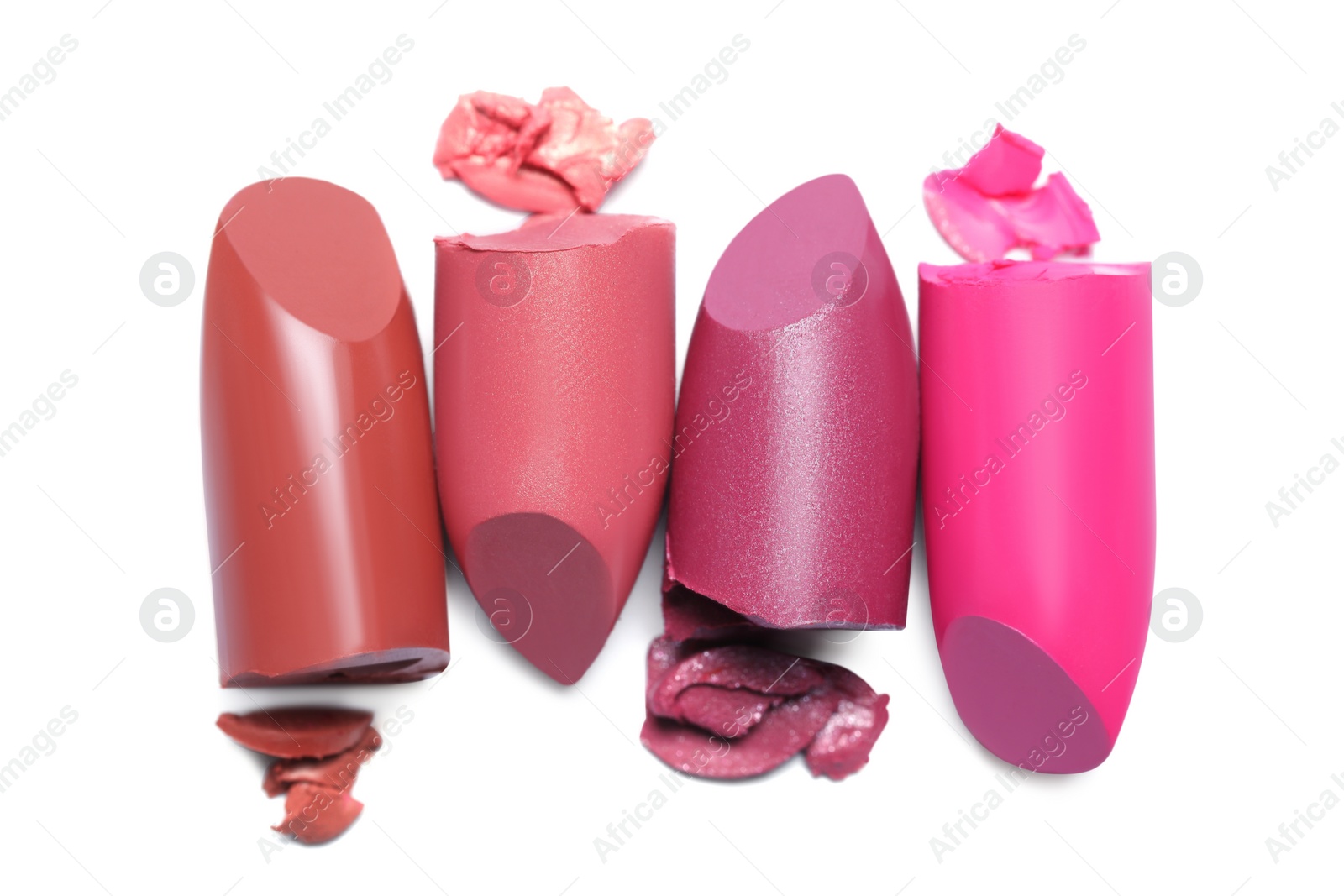 Photo of Many different bright lipsticks on white background, top view