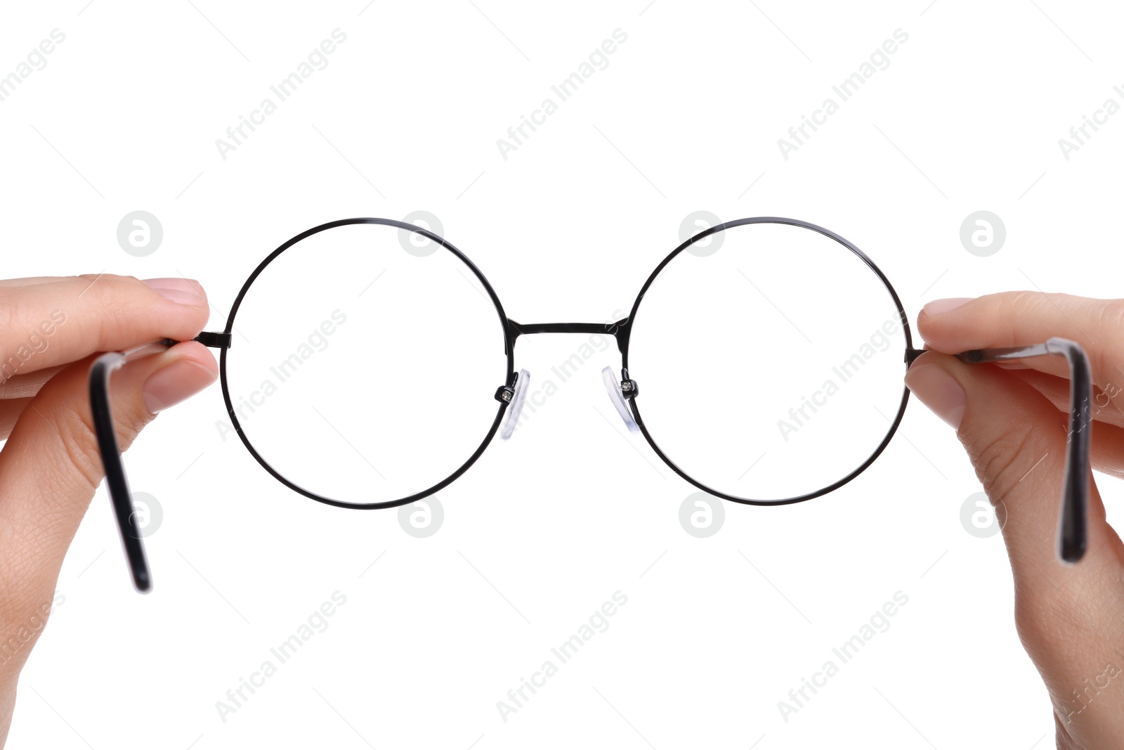 Photo of Woman holding round glasses with black frame on white background, closeup