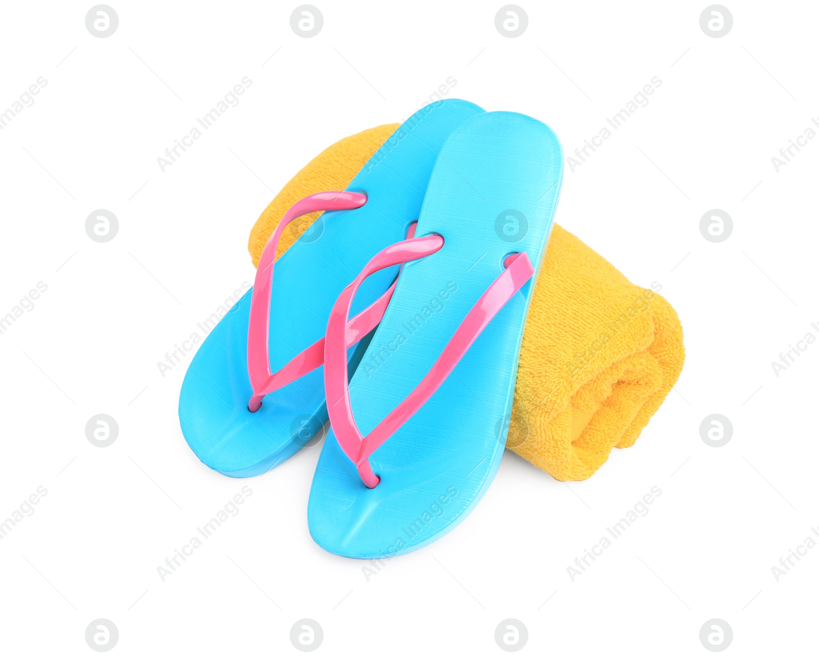 Photo of Yellow terry towel and flip flops isolated on white, top view. Beach objects