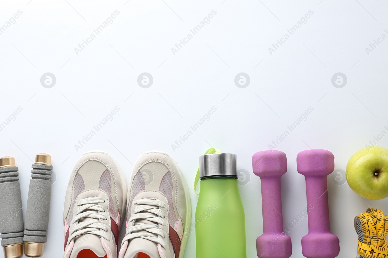 Photo of Composition with sport items on white background, top view. Space for text