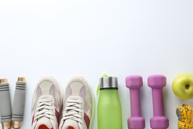 Composition with sport items on white background, top view. Space for text