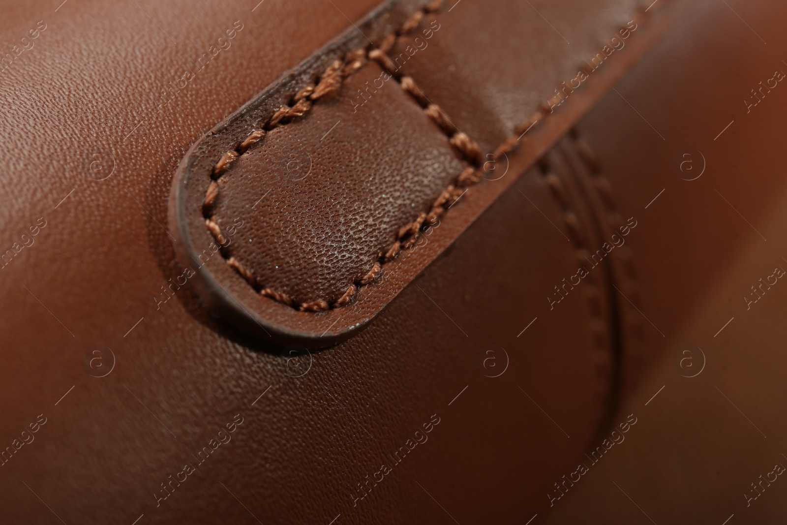 Photo of Texture of brown leather as background, closeup