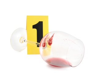 Photo of Wine glass with fingerprints and crime scene marker with number one isolated on white
