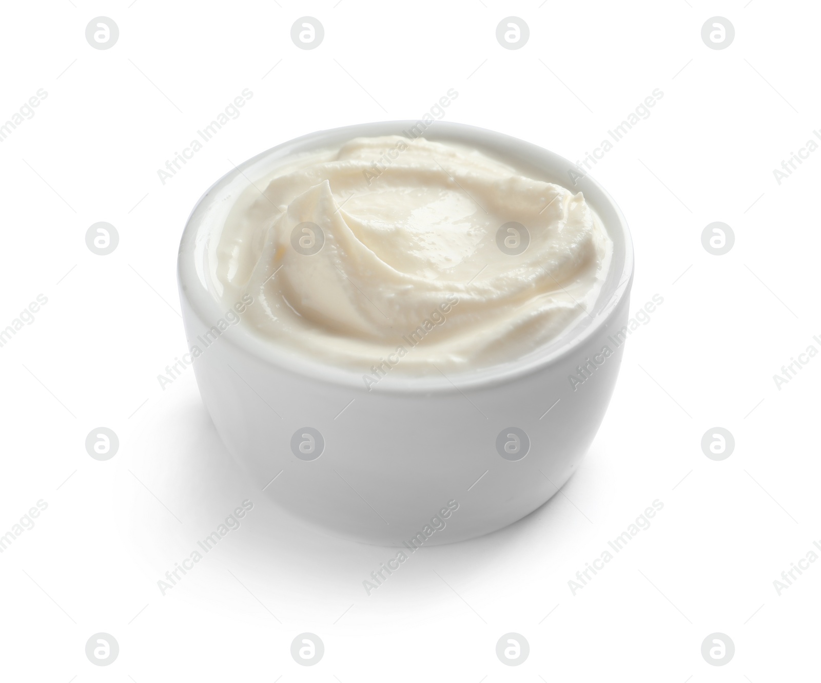 Photo of Bowl of tasty cream cheese on white background