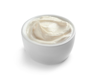 Bowl of tasty cream cheese on white background