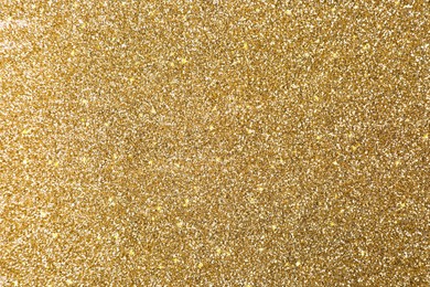Image of Beautiful shiny brass glitter as background, closeup