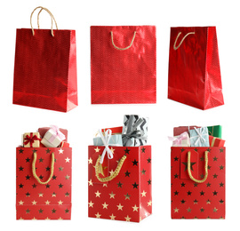 Image of Set of bright paper shopping bags on white background