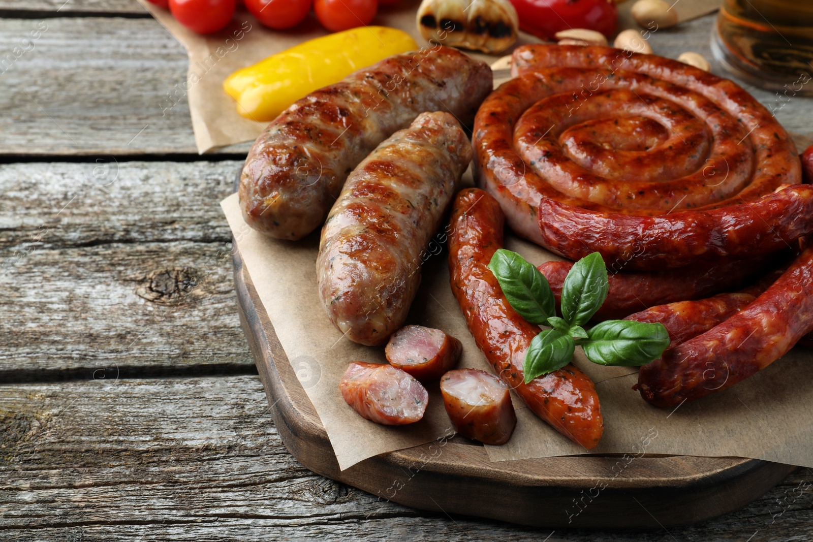 Photo of Set of different tasty snacks on wooden table, closeup view