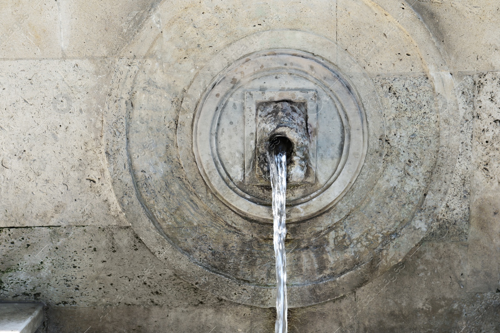 Photo of View of beautiful wall fountain on sunny day