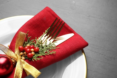 Photo of Beautiful Christmas table setting on grey background, closeup