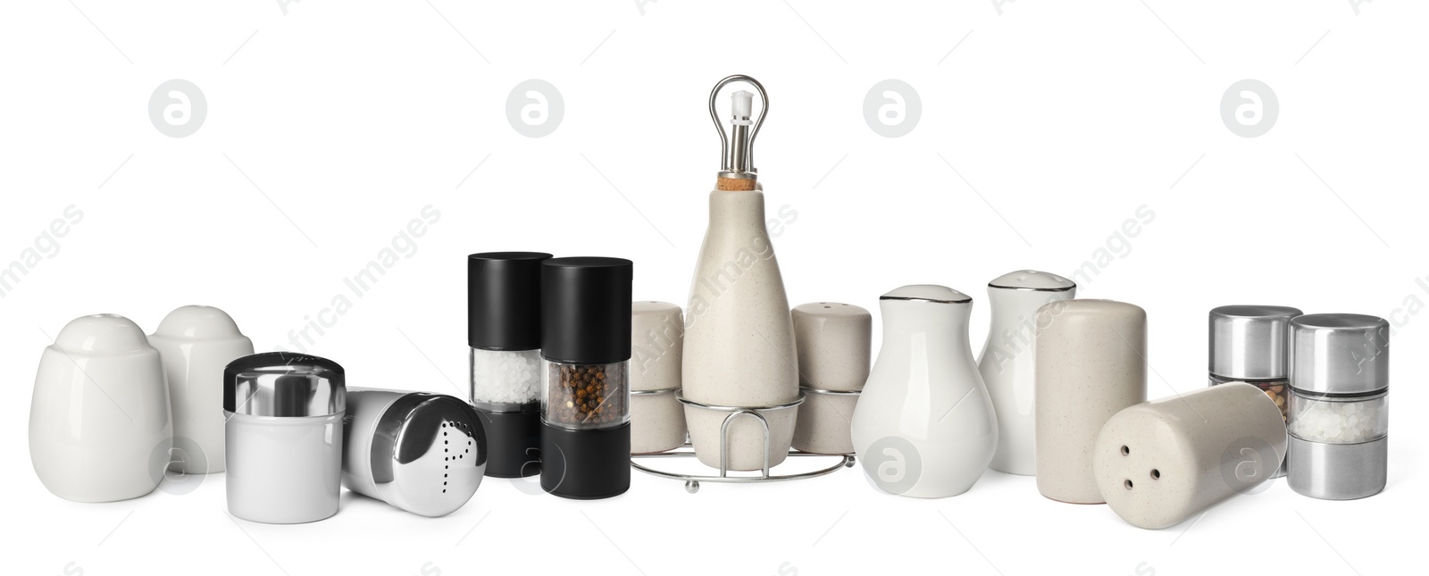 Image of Set with different pepper and salt shakers on white background. Banner design