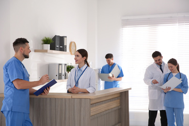 View of modern clinic with working doctors