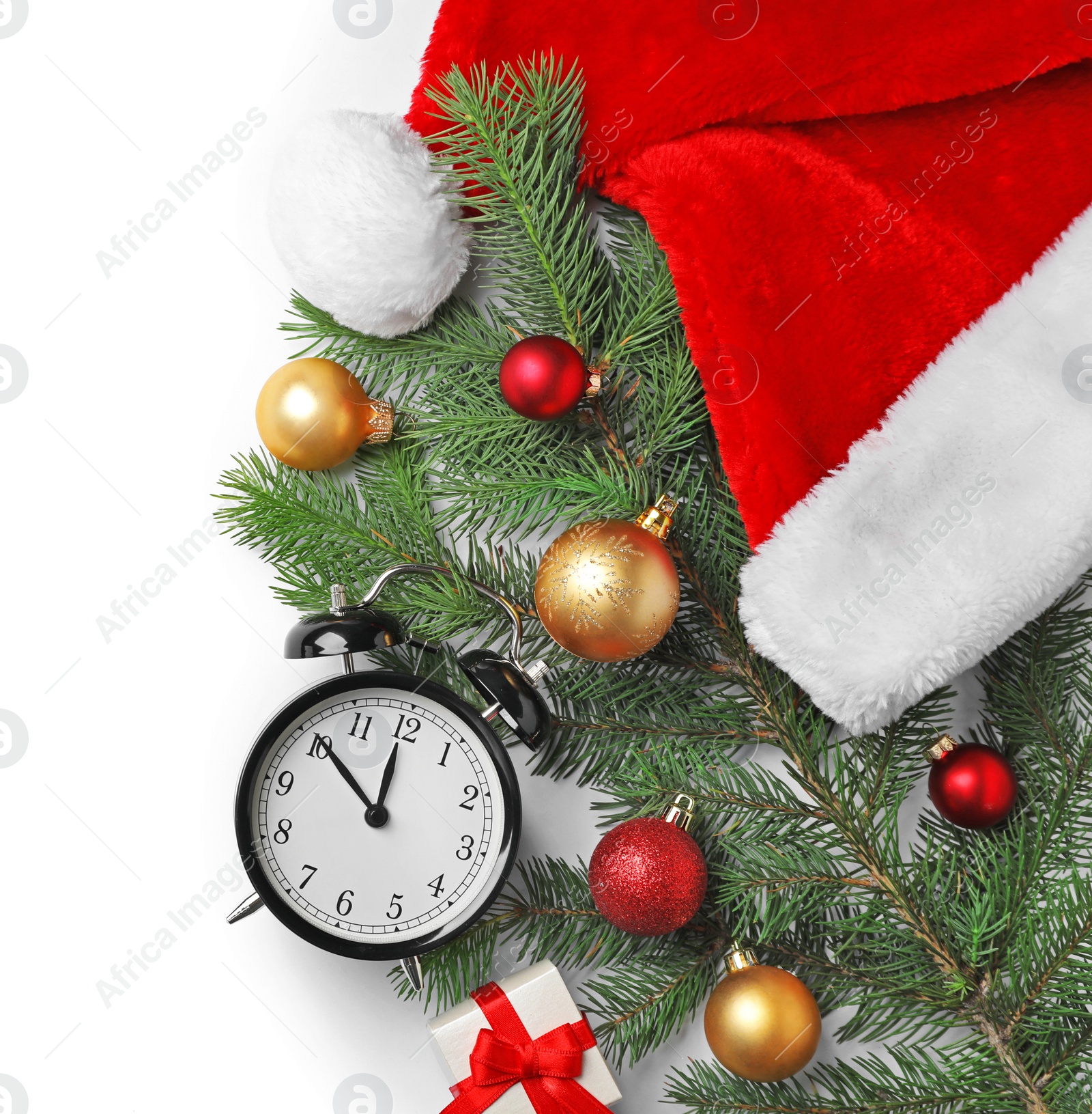 Photo of Retro alarm clock and different decor on white background, top view. Christmas countdown