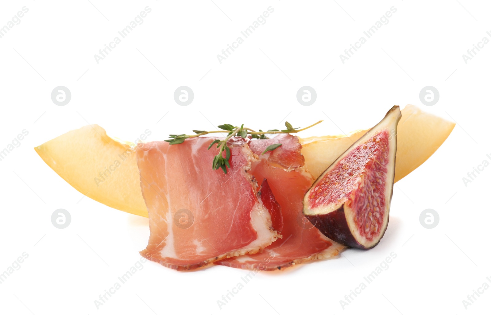 Photo of Melon slice with prosciutto and fig on white background