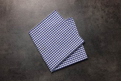 Photo of Checkered tablecloth on grey background, top view