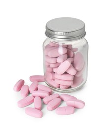 Photo of Bottle and pile of vitamin pills isolated on white