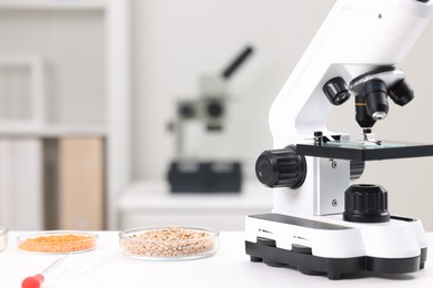 Food Quality Control. Microscope and petri dishes with different products in laboratory
