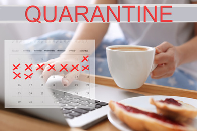 Woman with coffee using laptop at home and calendar. Quarantine during coronavirus outbreak