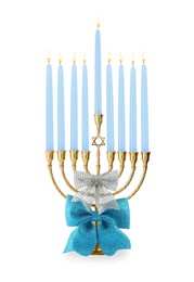 Photo of Hanukkah celebration. Menorah with light blue candles and bow isolated on white