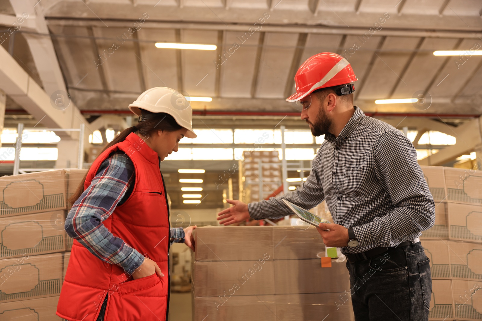 Image of Manager and supervisor at warehouse. Logistics center