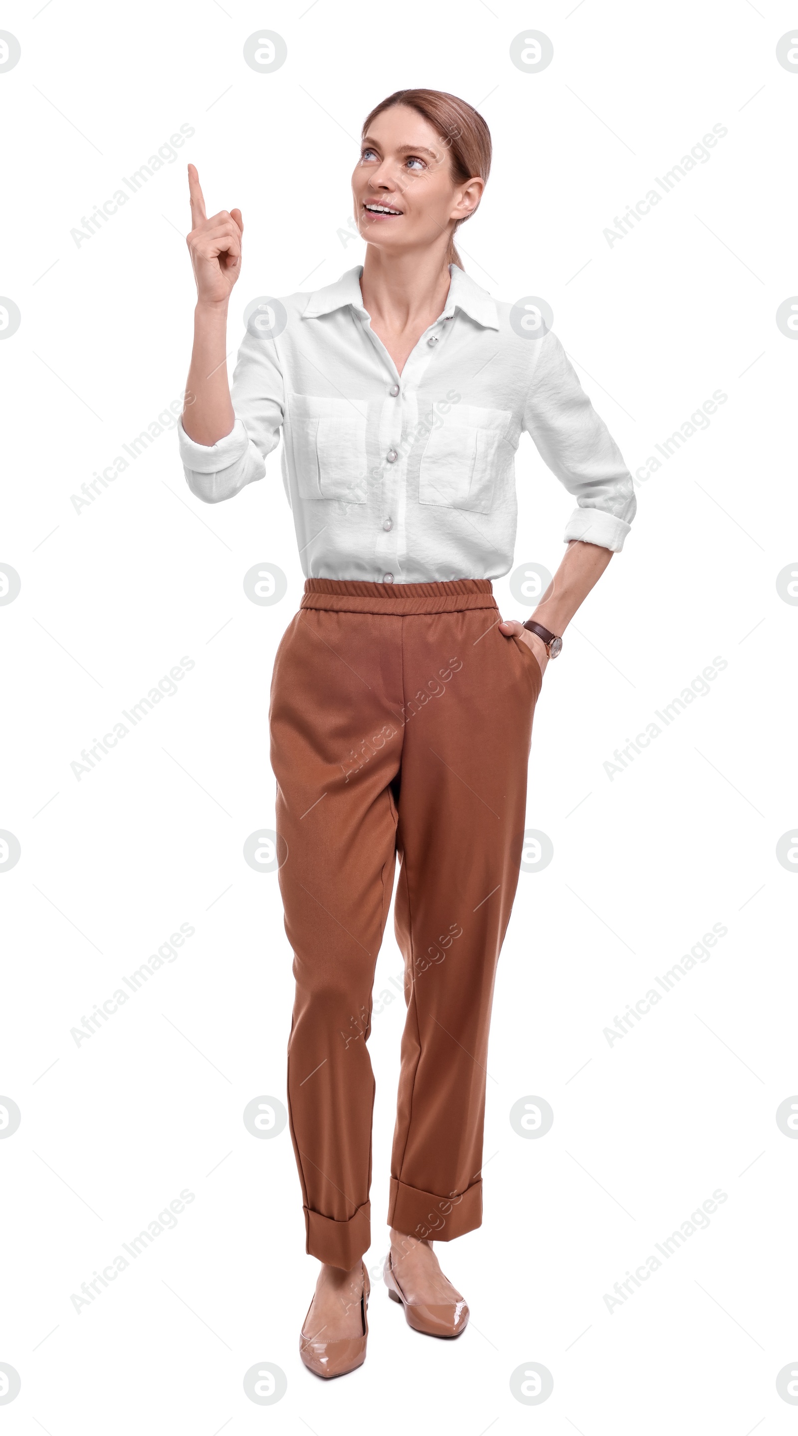 Photo of Beautiful happy businesswoman pointing at something on white background