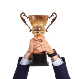 Photo of Young man holding gold trophy cup on white background, closeup