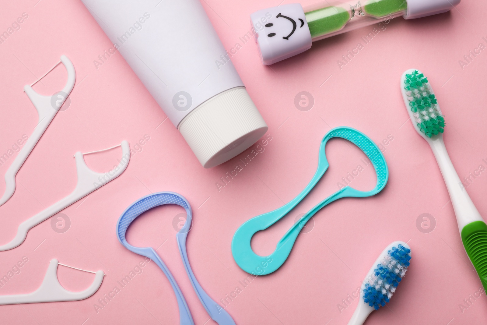 Photo of Flat lay composition with tongue cleaner on color background