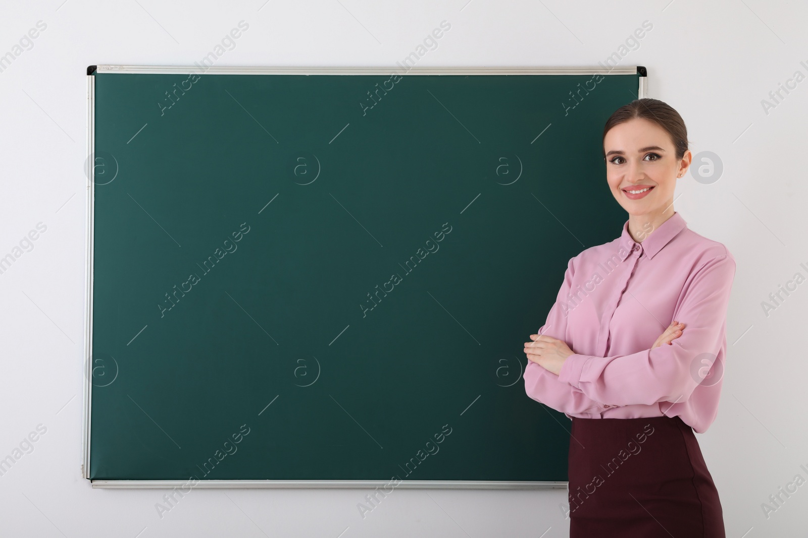 Photo of Portrait of young female teacher in classroom