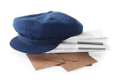 Blue postman's hat, envelopes and newspapers on white background