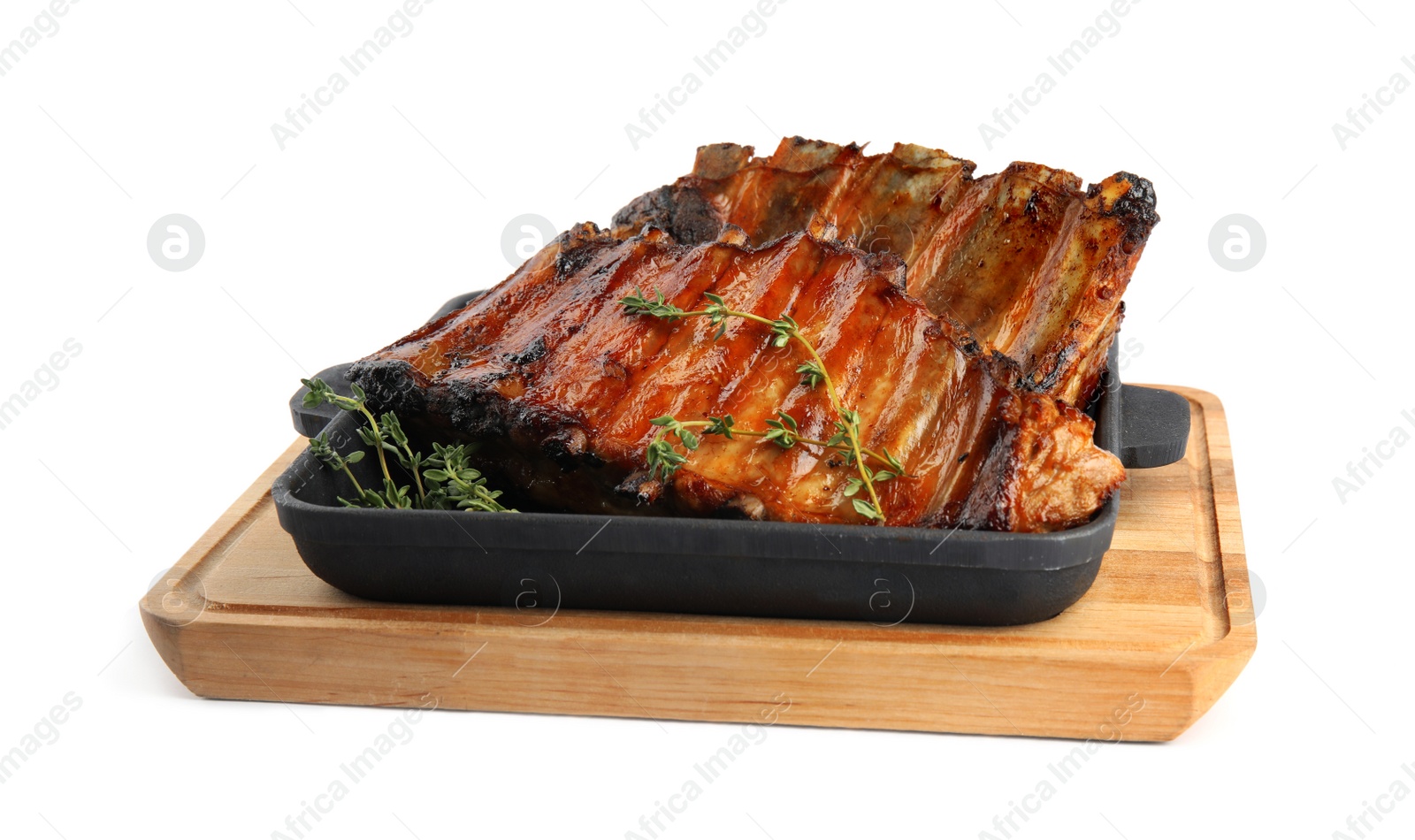 Photo of Tasty grilled ribs with thyme isolated on white