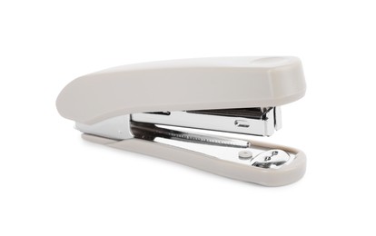 Photo of One new beige stapler isolated on white