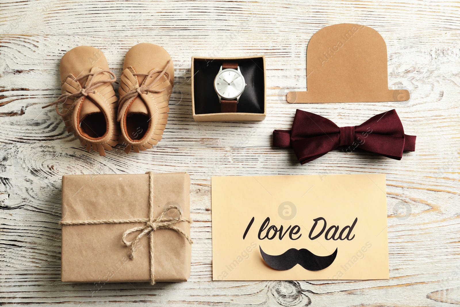 Photo of Flat lay composition with different gifts on wooden background. Father's day celebration