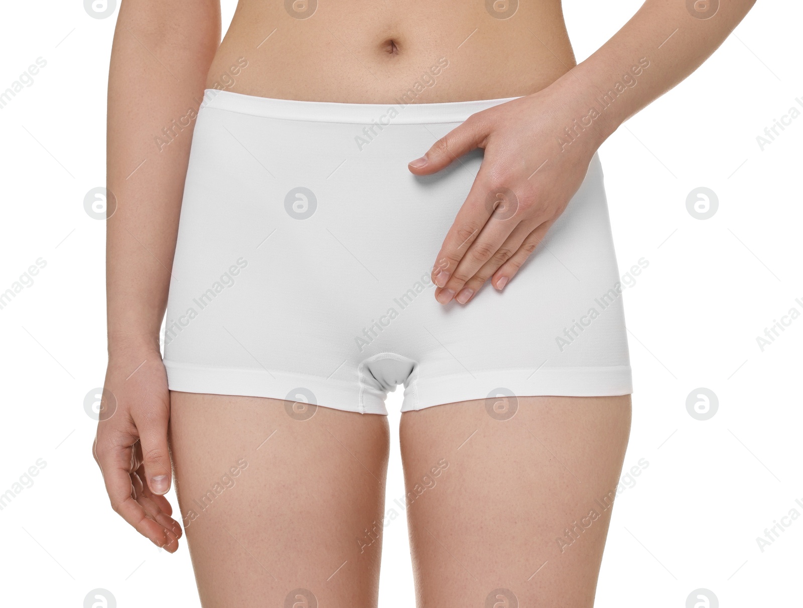 Photo of Woman holding hand near panties on white background, closeup. Women's health