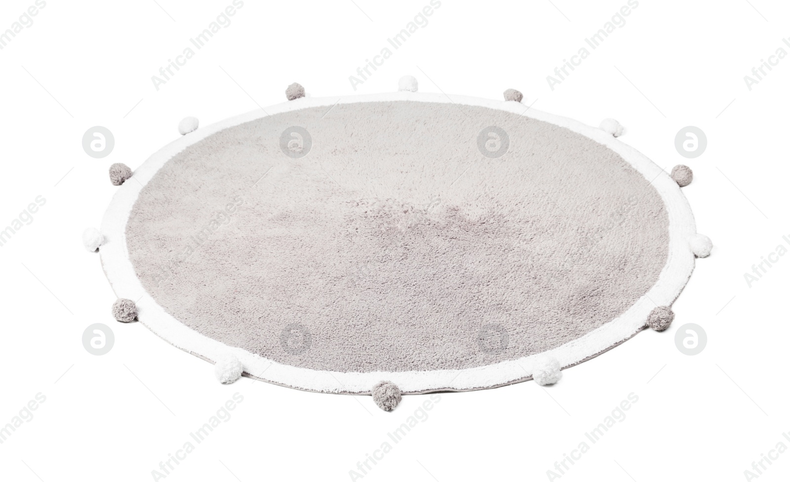 Photo of Round rug with pom poms isolated on white
