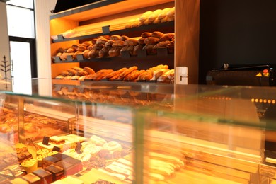 Photo of Fresh pastries on counter in bakery store