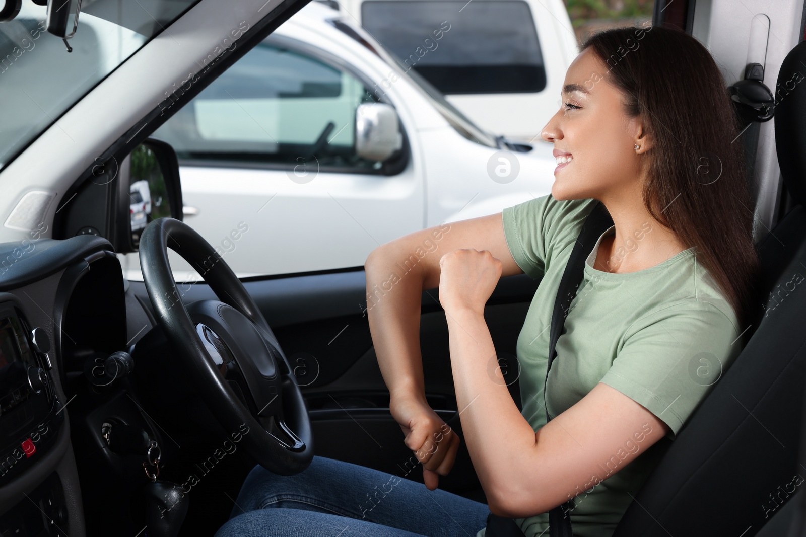 Photo of Listening to radio. Beautiful woman enjoying music in car