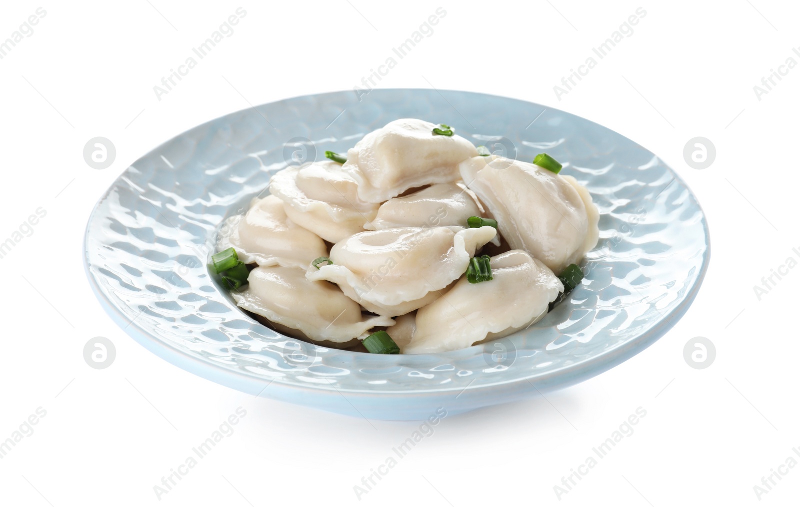 Photo of Plate of tasty dumplings served with green onion on white background