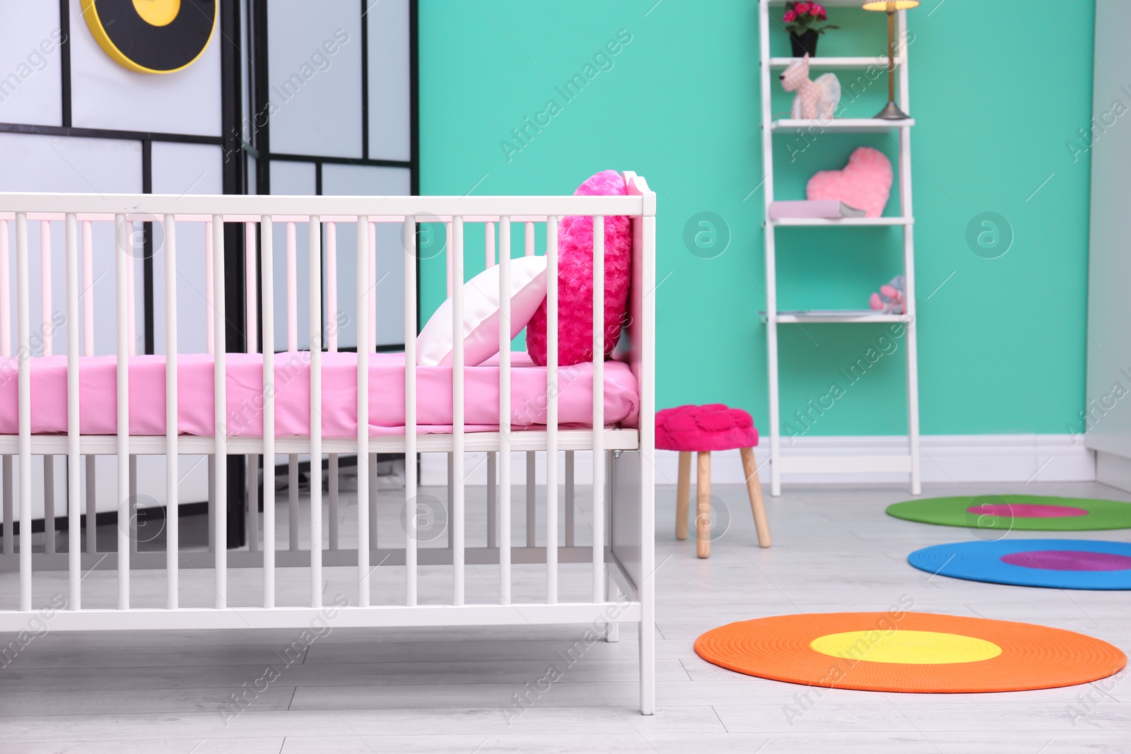 Photo of Light baby room interior with crib