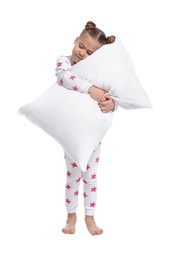 Girl in pajamas with pillow sleepwalking on white background