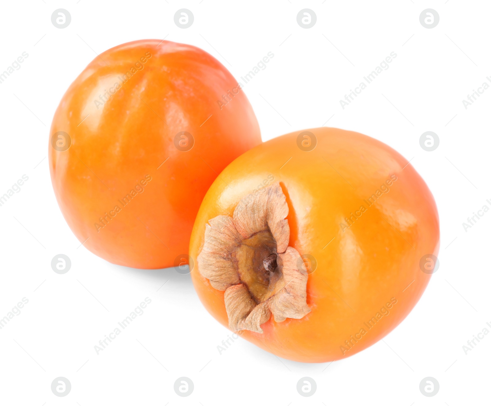 Photo of Delicious ripe juicy persimmons isolated on white