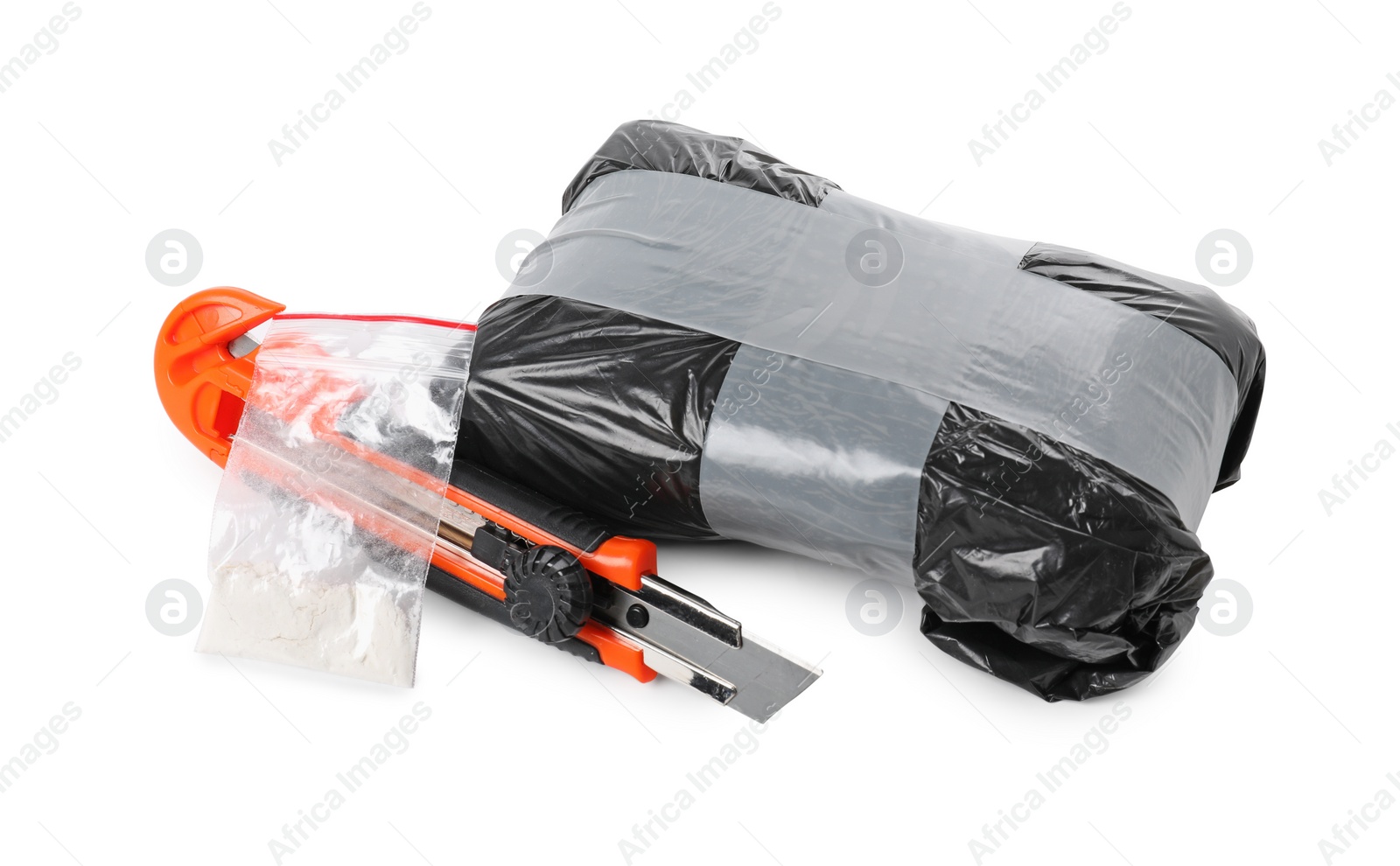 Photo of Packages with narcotics and stationery knife isolated on white