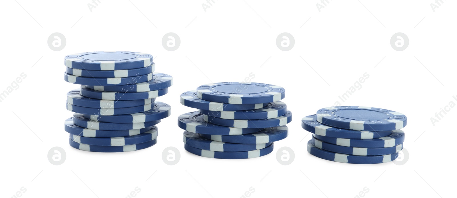 Photo of Stacks of casino poker chips on white background