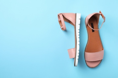 Photo of Pair of trendy women's shoes on color background, top view