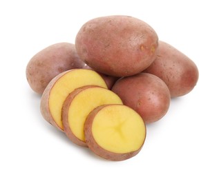 Whole and cut fresh potatoes on white background