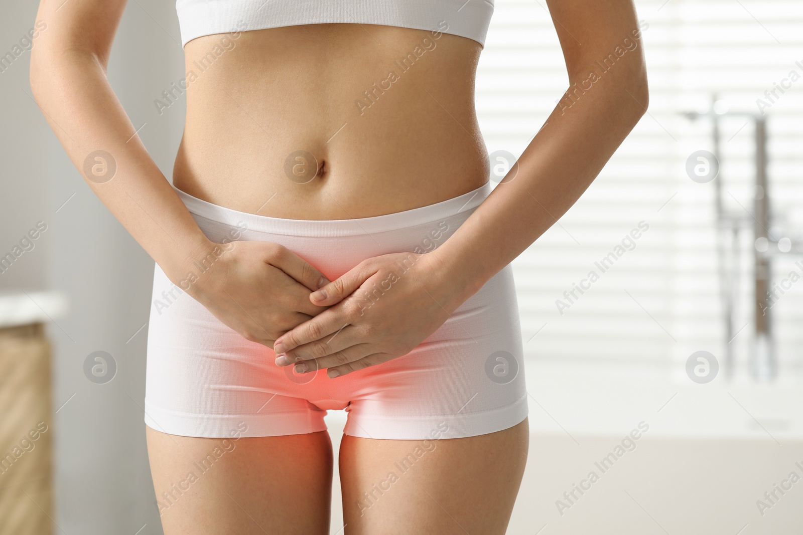 Image of Woman suffering from cystitis symptoms indoors, closeup