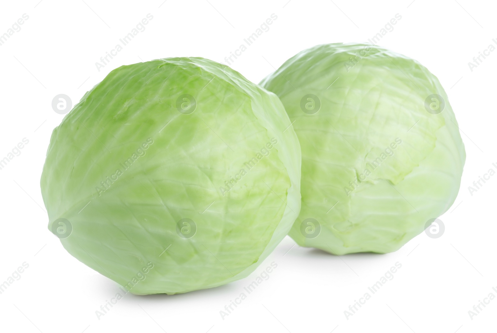 Photo of Whole fresh ripe cabbages isolated on white