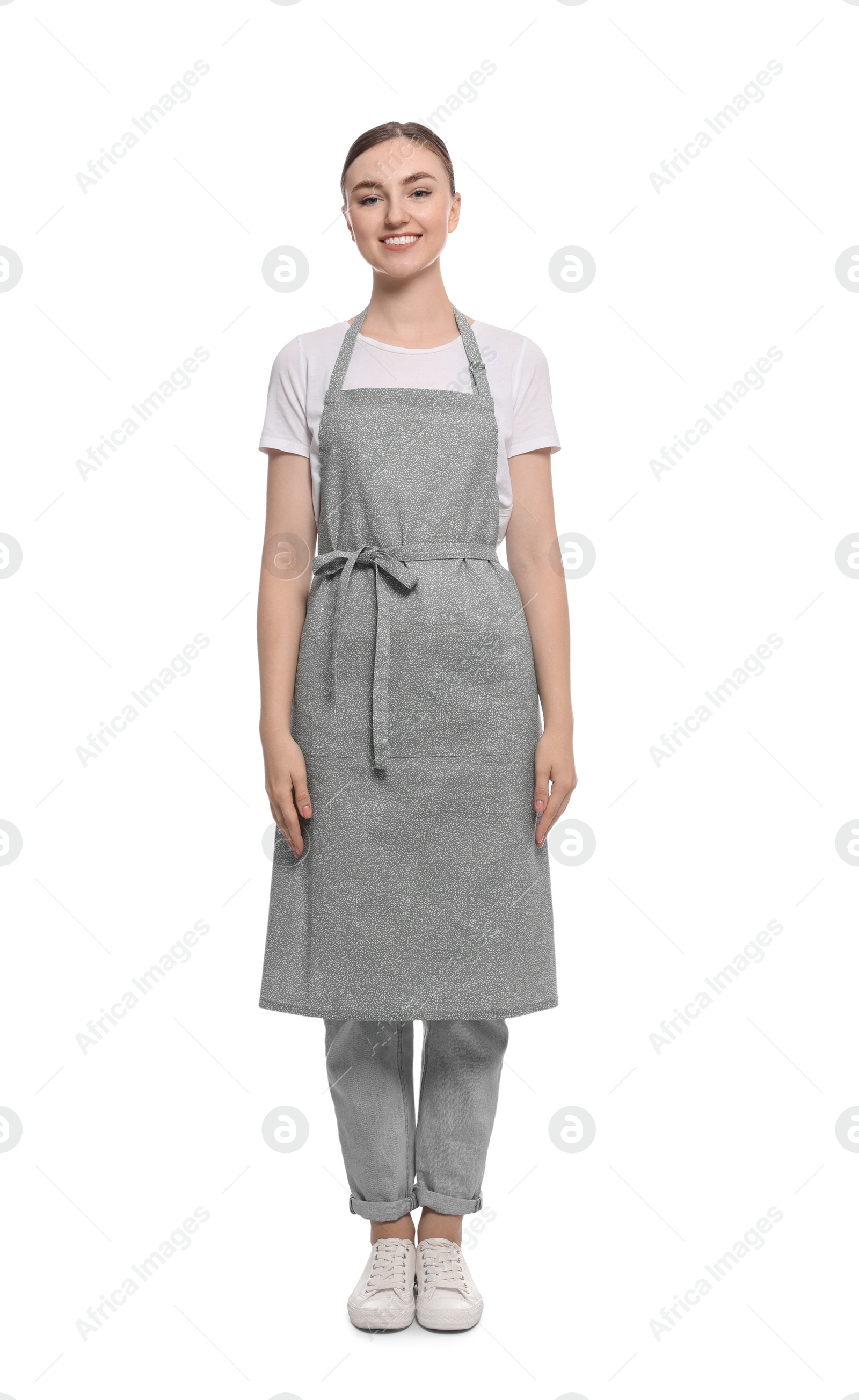 Photo of Beautiful young woman in clean apron on white background