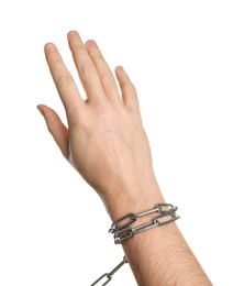 Photo of Freedom concept. Man with tied chains on his hand against white background, closeup