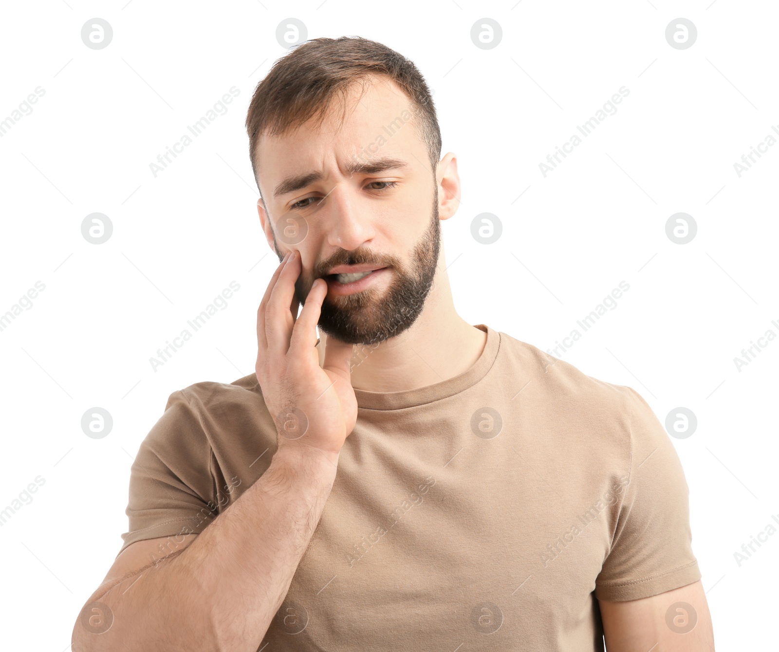 Photo of Young man suffering from toothache on white background